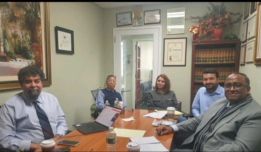 Ghulam Shabbir Babar at a meeting in a New York law office